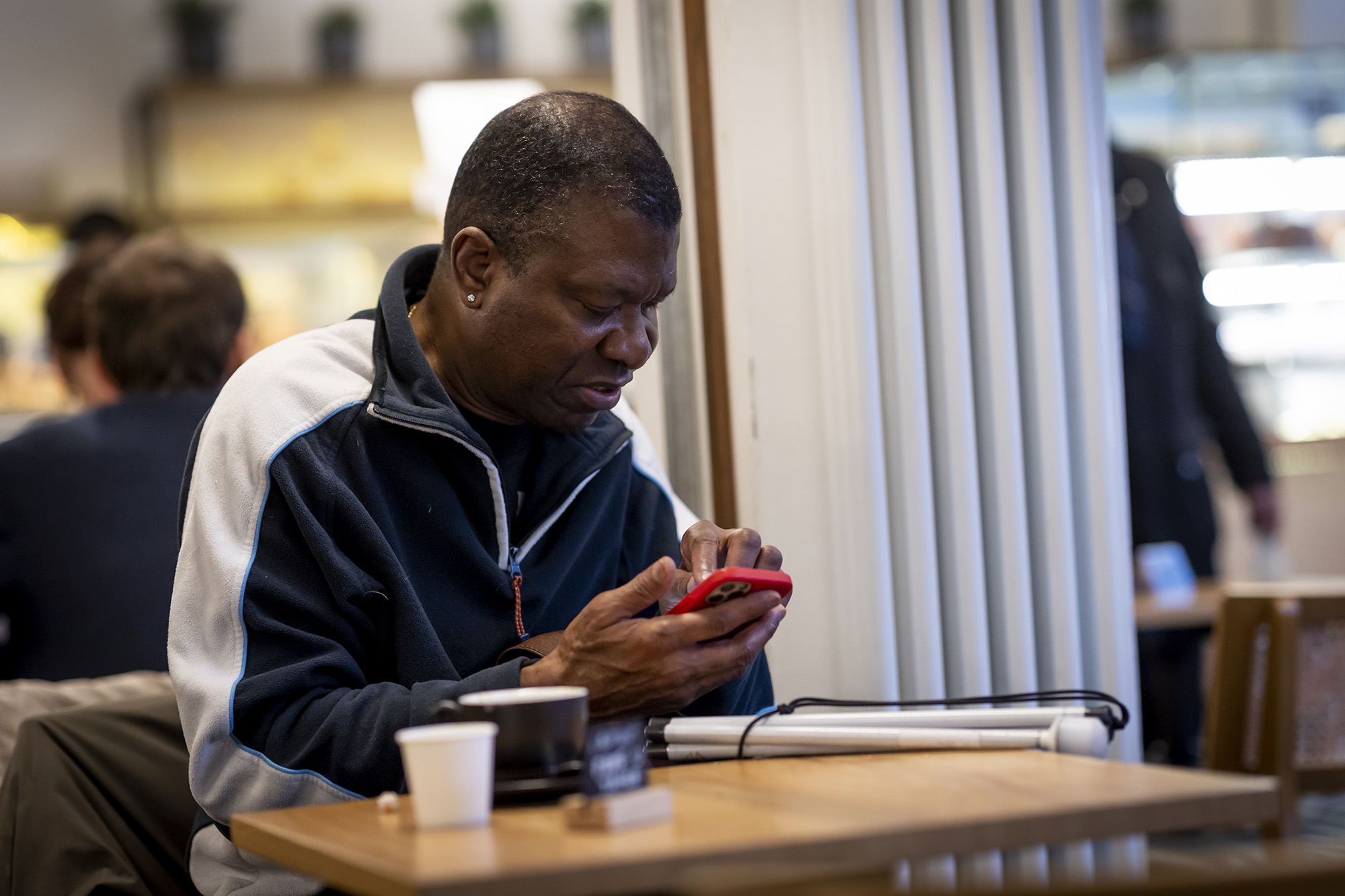 Older adult maintaining independence using low vision resources and adaptive tools